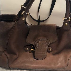 Authentic Gucci handbag in light tan leather.